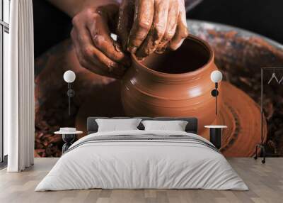 hands of a potter, creating an earthen jar on the circle Wall mural