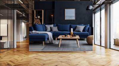 Two knitted poufs near dark blue corner sofa. Scandinavian home interior design of modern living room Wall mural