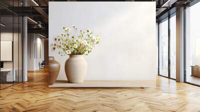 Wooden table with beige clay vase with bouquet of chamomile flowers near empty, blank white wall. Home interior background with copy space Wall mural