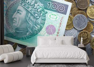 Polish money. One hundred zlotys on the background of Polish coins. Top view Wall mural