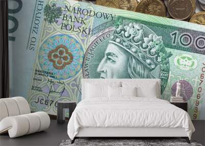 Polish money. One hundred zlotys on the background of Polish coins. Top view Wall mural