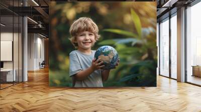 Boy holding a globe in the garden, Earth Day Wall mural