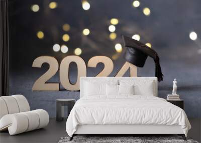 Class of 2024 concept. Number 2024 with graduated cap and bokeh lights. Wall mural