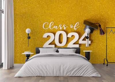 Class of 2024 text. Golden glitter background with number 2024 and graduated cap Wall mural