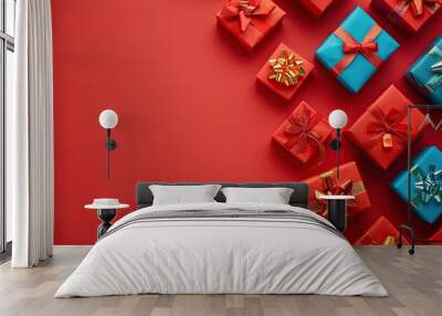 Colorful christmas gift boxes with copyspace on red background Wall mural