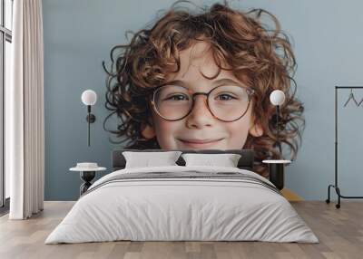 Cute little boy in eyeglasses on grey background Wall mural