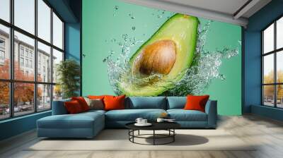 Fresh avocado falling in transparent water Wall mural