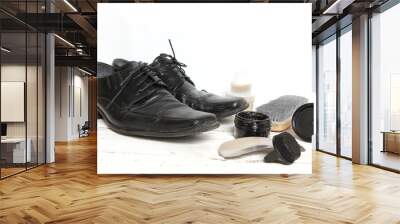 shoe care equipment and formal black shoe on white background Wall mural