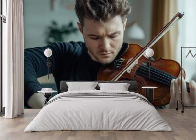 Handsome man musical artist playing violin at home Wall mural