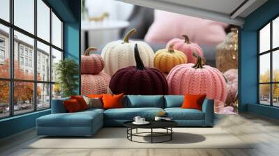 Knitted colourful pumpkins and candles. Thanksgiving home decor concept. AI Generative. Wall mural