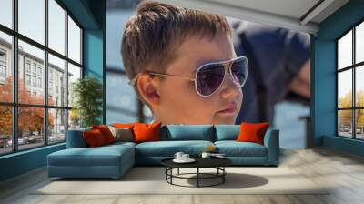 Portrait of a young man in sunglasses. Wall mural