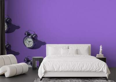 Pattern of an alarm clock on a colored background. Monochrome time concept. Banner format. Wall mural