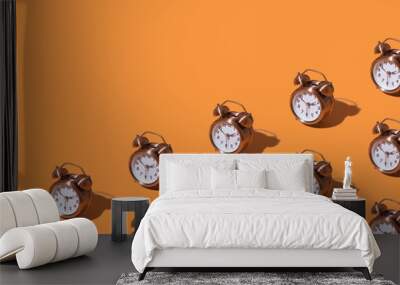 pattern of an alarm clock on a colored background. monochrome time concept Wall mural