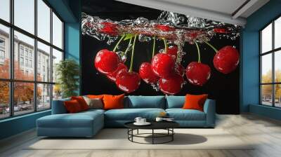 Red cherries falling into water on black background Wall mural