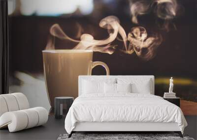 Close up of steaming cup of coffee or tea on vintage table - early morning breakfast on rustic background Wall mural