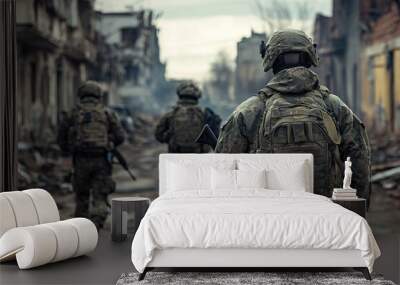 Soldier with assault rifle in military uniform is ready for storm in city streets Wall mural