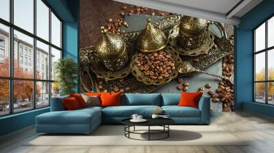 traditional turkish coffee in vintage cup in metal service, anise, roasted beans on brown background 1 Wall mural