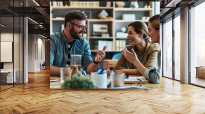 Colleagues in the office are talking in a meeting room, at a meeting. A group of employees work indoors together. Teamwork concept. Wall mural