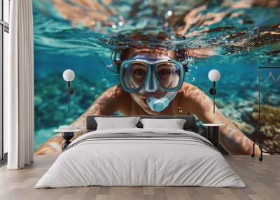 Underwater photo of young woman swimming near corals and reefs Wall mural