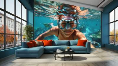 Underwater photo of young woman swimming near corals and reefs Wall mural