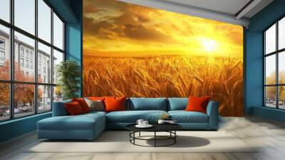 Yellow field with ripe wheat ears on sunset background Wall mural