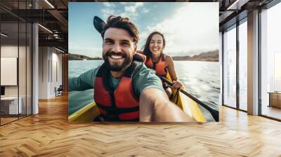 Young couple kayaking on lake Wall mural