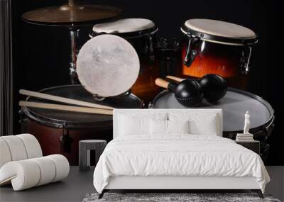 Different drums on a black background, percussion musical instruments Wall mural