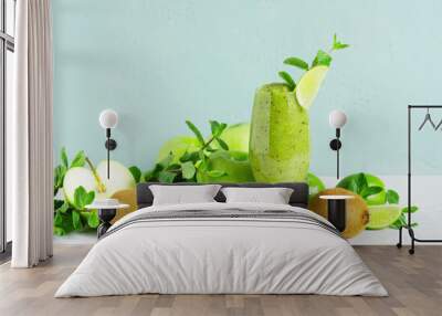 One glass of fresh green fruit smoothie on the table Wall mural