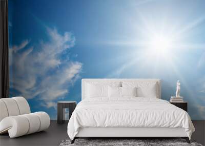 Cumulus clouds and bright sun in the sky. Wide photo. Wall mural