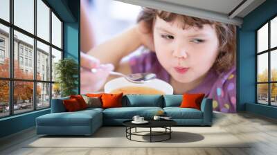 Cute little girl doesn't want to eat. Kid refusing food. Sad child Wall mural