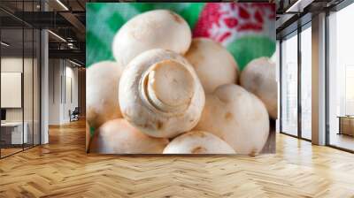 Fresh, raw champignons lie on the fabric, ready for cooking. Wall mural