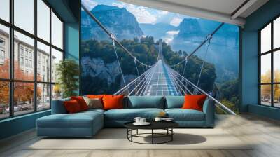 A transparent bridge links two mountains, providing stunning views of cliffs and forested hills Wall mural