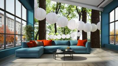 paper lanterns in the park in the trees. sunny. summer Wall mural