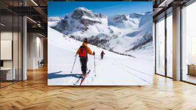 Men ski touring in the mountains on snow, exploring the Dolomite Wall mural