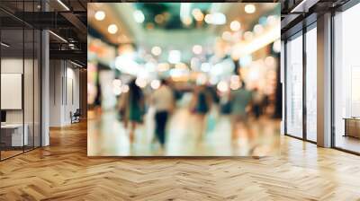 People walking on shopping mall Defocused blurred background of people walking on shopping mall. Wall mural