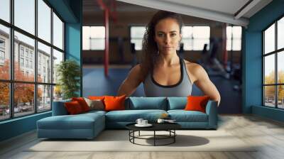 portrait of female gym instructor at gym Wall mural