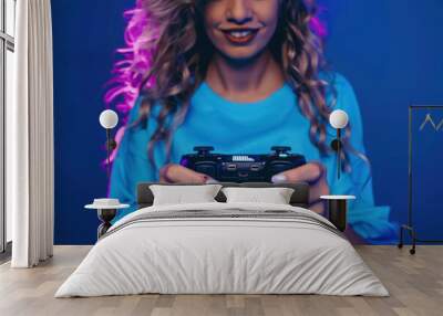 Woman holding joystick and playing Woman holding joystick and playing Wall mural