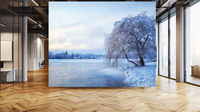 Winter landscape with lake and tree in the frost with falling sn Wall mural