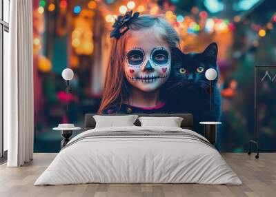 A charming little girl in Halloween face paint poses with a friendly black cat. Surrounded by colorful lights, this festive scene captures the joy of the Halloween season. Wall mural