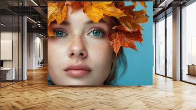 Autumn Portrait with Leaf Crown and Blue Background Wall mural