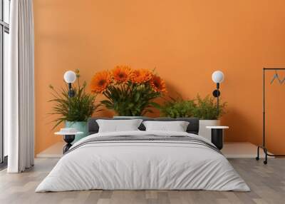 A bright planter on a pastel orange backdrop with room for writing Wall mural