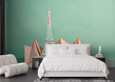 Folded paper Eiffel Tower on a pastel mint backdrop with space for writing Wall mural