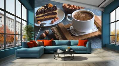 Breakfast. Coffee morning , with a slice of cake and hazelnuts on a textural background. Wall mural