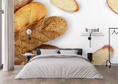 Rye bread, a loaf of wheat, and a baguette with sesame seeds. Sliced baguette . Isolated on a white background. Top view Wall mural