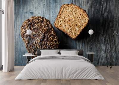 whole and half of  tasty handmade rectangular rye bread Wall mural