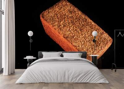 whole loaf of rectangular rye bread with sesame seeds Wall mural