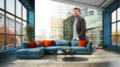 young elegant man in front of a hotel Wall mural