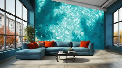 
Shadows of tropical leaves on the crystal clear surface of azure blue water, view from above. Abstract banner concept background for summer beach weekend Wall mural