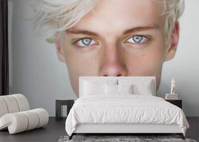 studio photo portait of a pale skin white hair blue eyes young man. isolated on white Wall mural