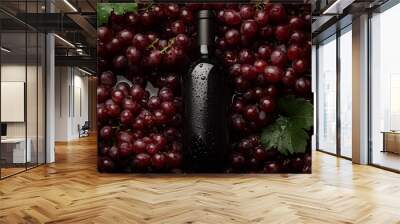 top view of a mock-up wine bottle on the red grapes with water drops , wine commercial photography Wall mural